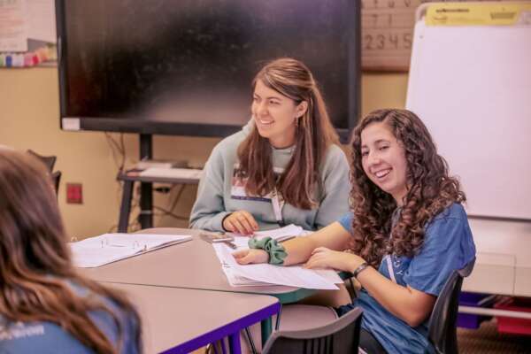Students lesson planning in a primary school classroom