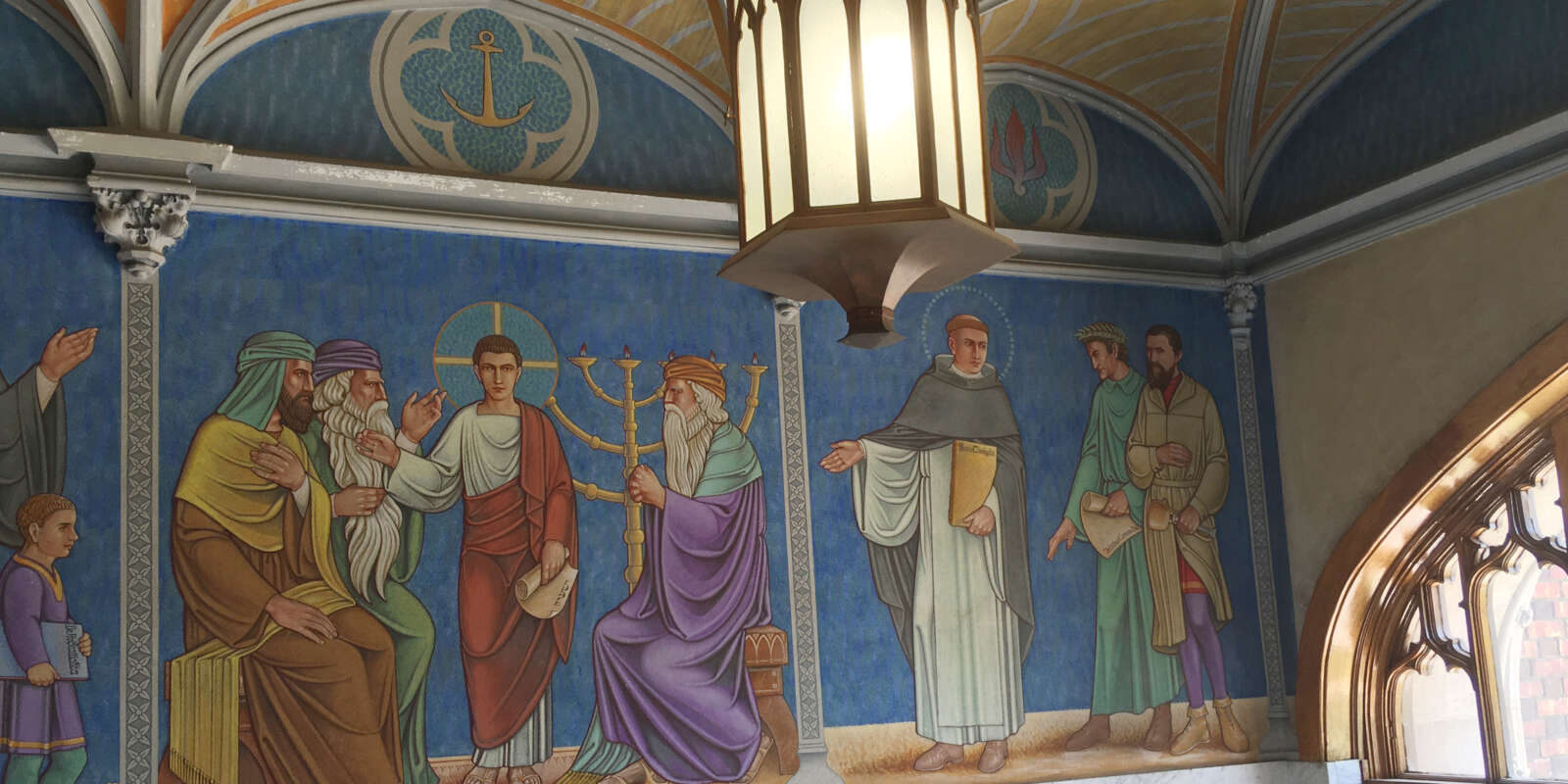 The mural in the entrance of St. Benedict Hall