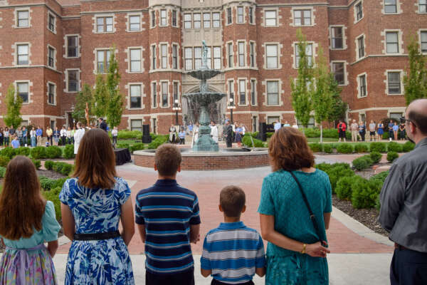 Families praying in the Academic Quad