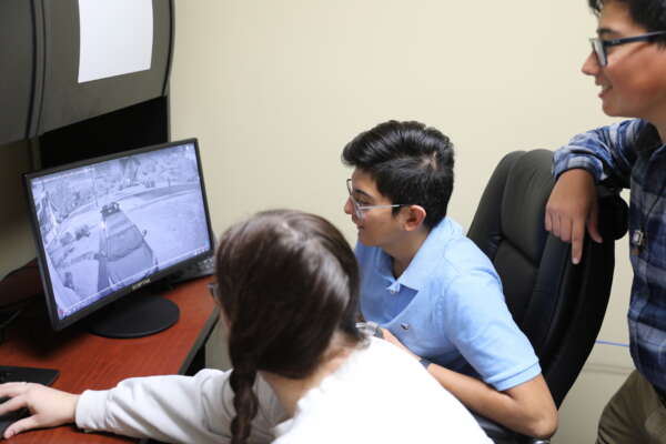 Students analyzing footage
