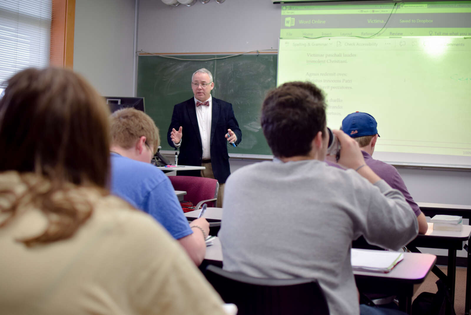 Dr Mulholland teaching with a projector