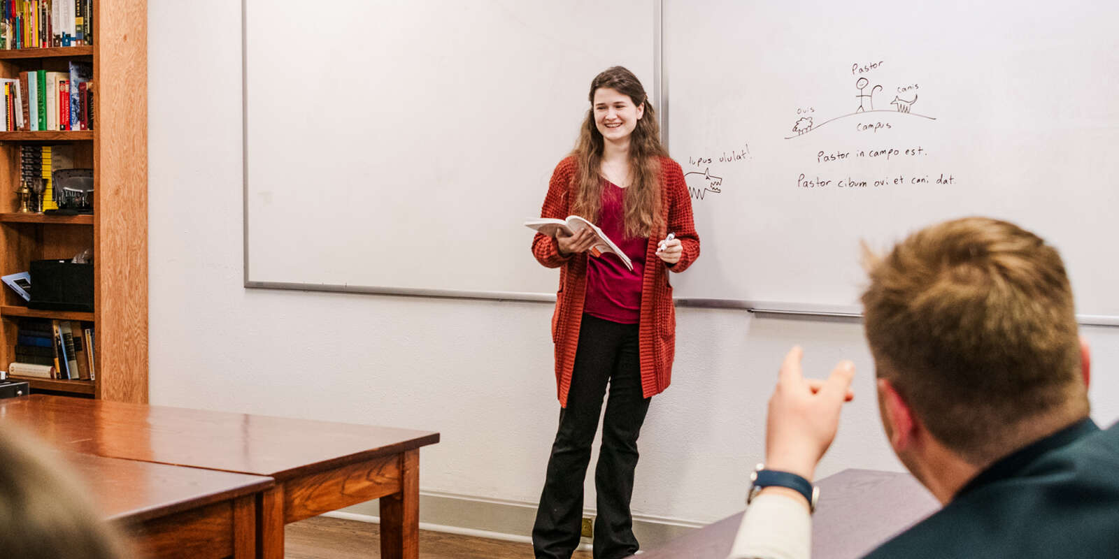 A teacher teaches Latin in class