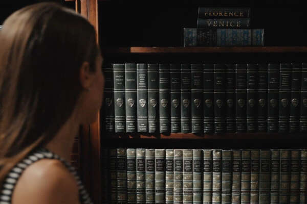 A student reads a book in a seminar class