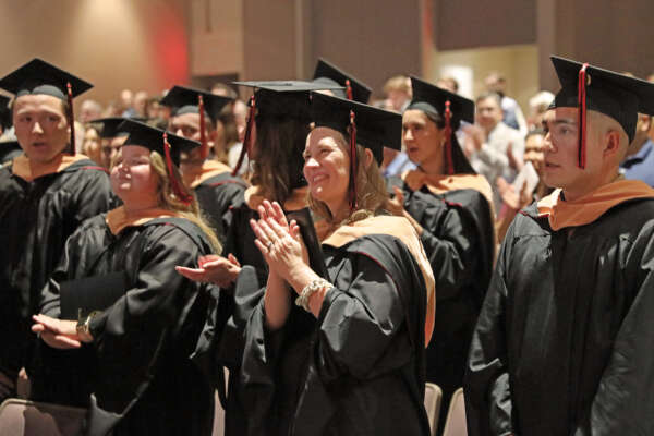 MBA graduates at the hooding ceremony