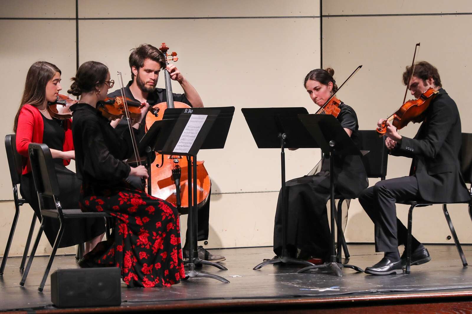 Students performing in a string quintet