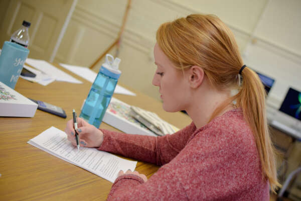 Student studying at a table