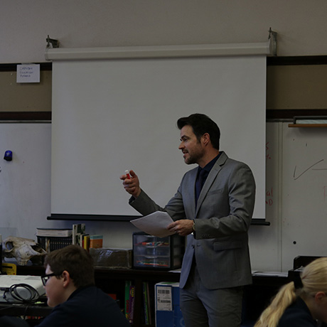 An instructor teaches in a primary school setting