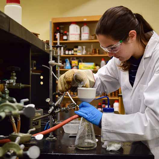 A student working in Chemistry class