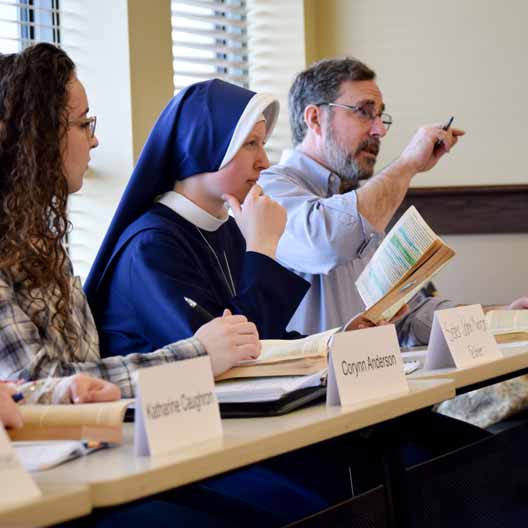A professor makes a point in a Great Books seminar class