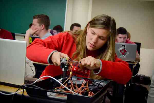 A student works with electronics in class