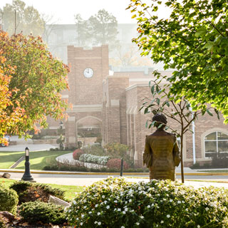 Wangari Statue with the clock tower in the background.