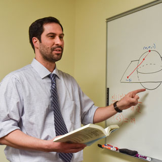 Professor explaining a concept on the board