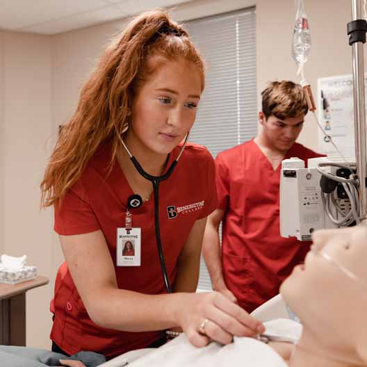 Nursing students practicing taking care of a patient