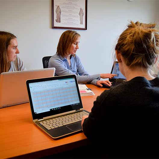 Professor talking with a few students