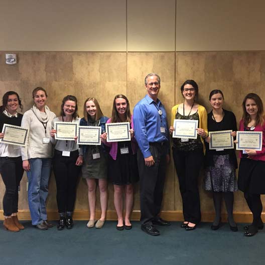 Students pose with certificates