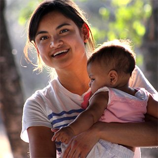 Missionary holding a baby