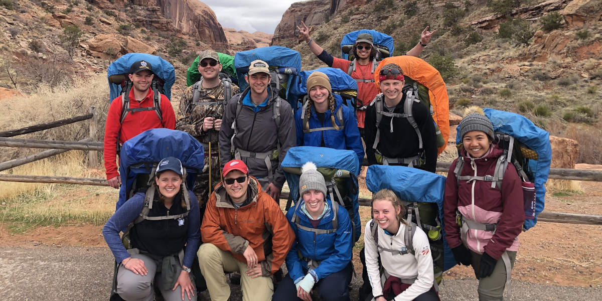 Students posing in hiking/camping gear