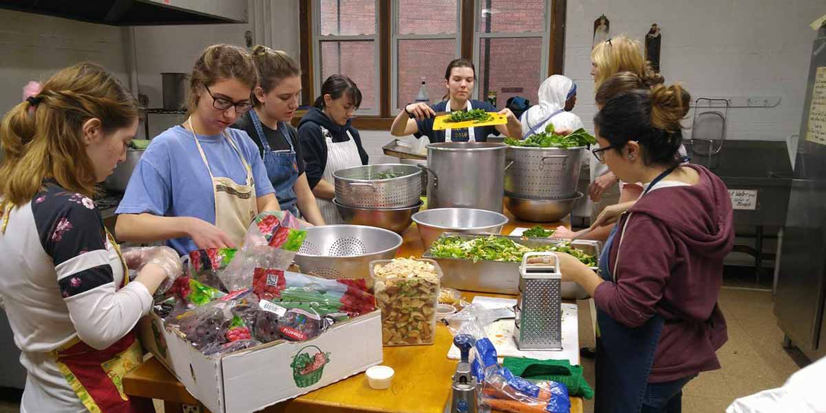 Missionaries preparing food
