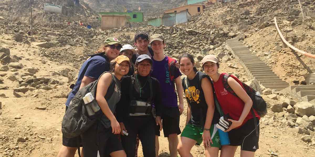 Smiling by stairs built in Peru